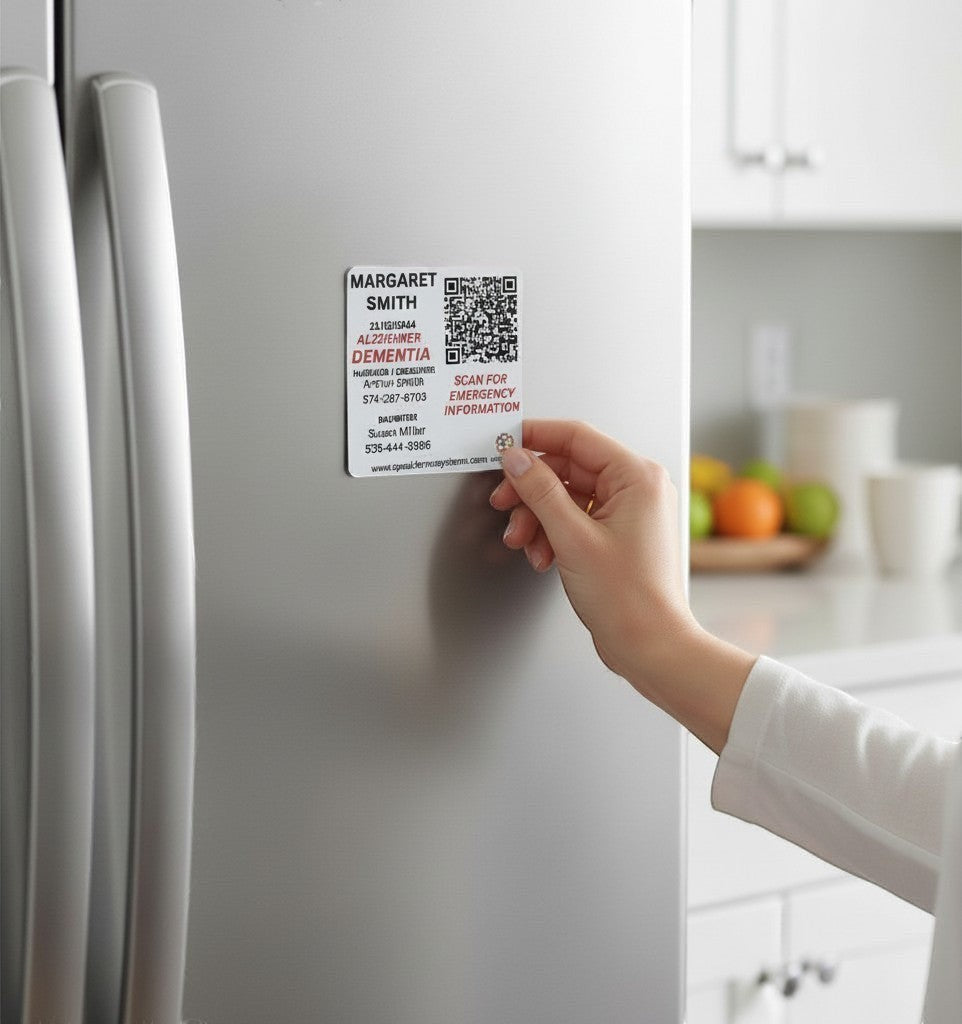 Speak For Me Systems square aluminum emergency medical magnet with QR code attached to a stainless steel refrigerator.