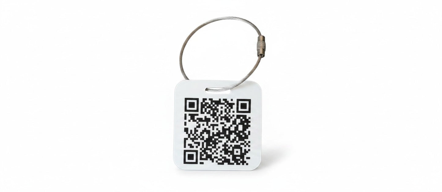 Speak For Me Systems square white tag with a black QR code and a durable metal wire loop attachment.