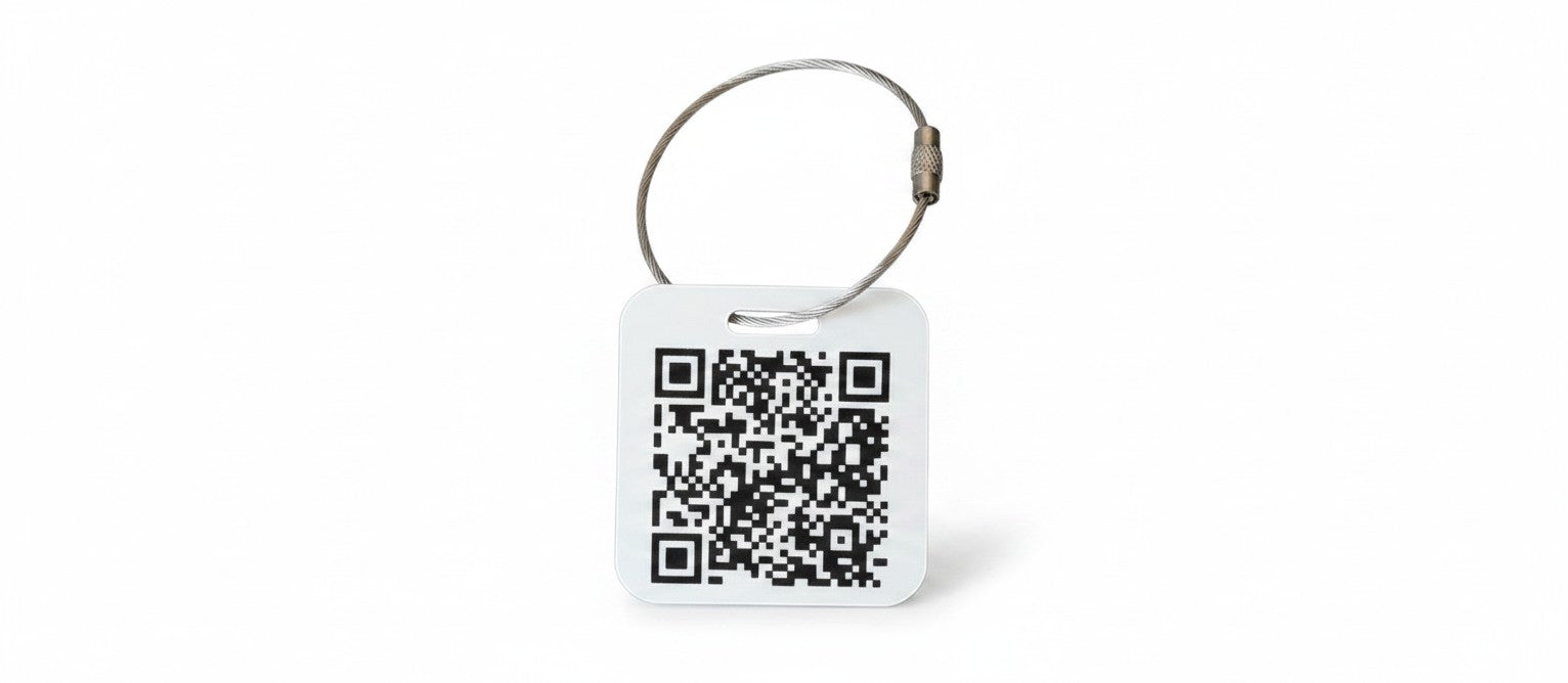 Speak For Me Systems square white tag with a black QR code and a durable metal wire loop attachment.