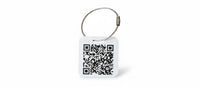 Speak For Me Systems square white tag with a black QR code and a durable metal wire loop attachment.